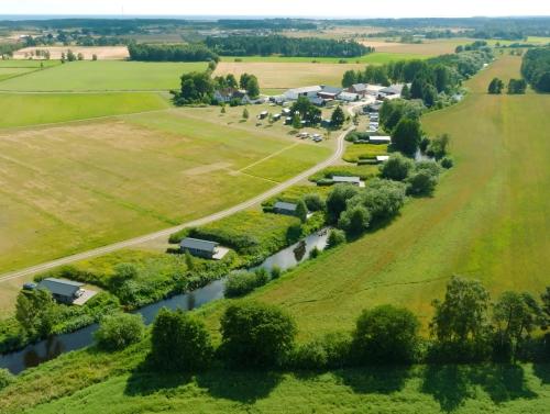 an aerial view of a village with a river at Gangvidefarm in Stånga