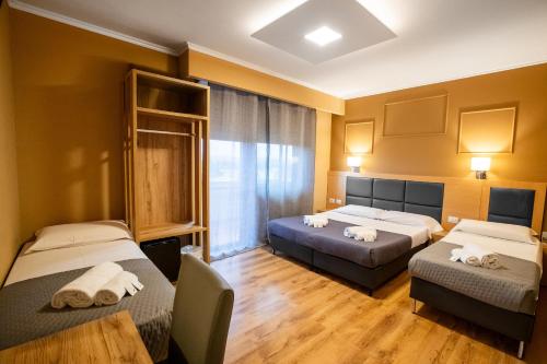 En eller flere senge i et værelse på EURHOTEL