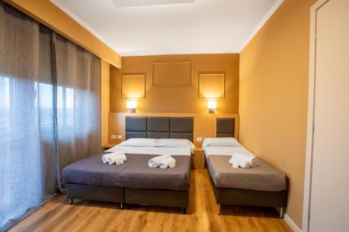 En eller flere senge i et værelse på EURHOTEL