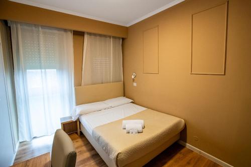 En eller flere senge i et værelse på EURHOTEL