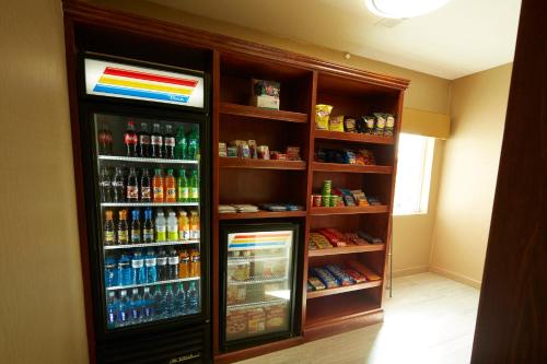 a refrigerator filled with lots of different types of drinks at Holiday Inn Express & Suites Carmel North – Westfield by IHG in Carmel
