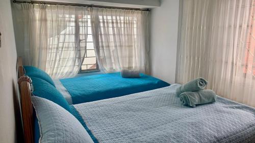 Katil atau katil-katil dalam bilik di Villa Elena