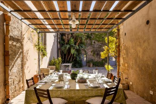 a table and chairs on an outdoor patio at Masseria Costanza Vendicari in Noto