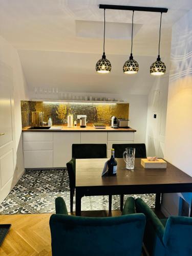 a kitchen and dining room with a table and chairs at Villa Edelweiss Stuhleck in Spital am Semmering