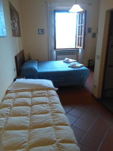 Ένα ή περισσότερα κρεβάτια σε δωμάτιο στο Agriturismo Marrucola