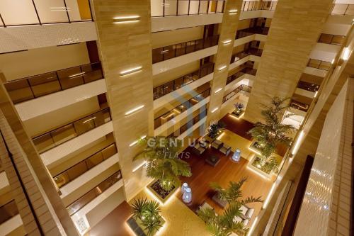 an overhead view of the lobby of a building with palm trees at Eco Summer Tambaú WB Genius Flats in João Pessoa