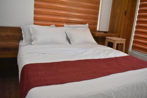 Postel nebo postele na pokoji v ubytování Forest Brew Resort Wayanad