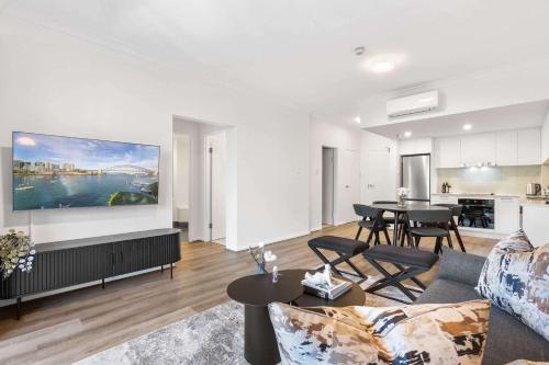 a living room with a couch and a table at Camperdown Cozy Corner 7 in Sydney