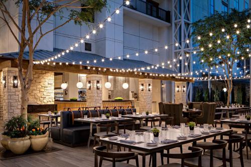 a restaurant with tables and chairs and lights at Gaylord Texan Resort and Convention Center in Grapevine