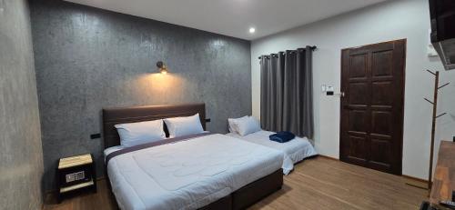 Lanta Mango Beach Housesにあるベッド