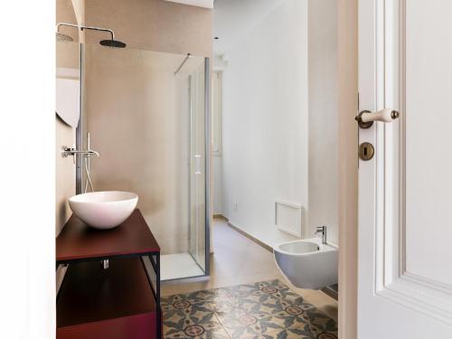 a bathroom with two sinks and a shower at Apartment in Giarre near Mount Etna in Giarre