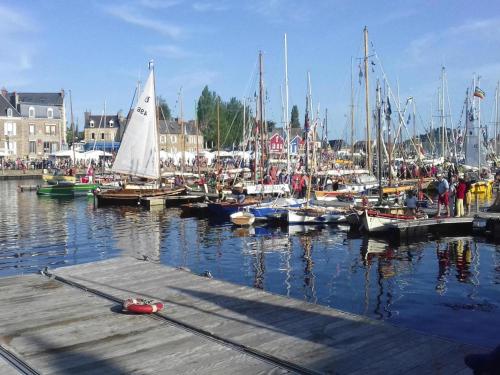 a group of boats are docked in a harbor at Terraced House in Lanmodez near Sandy Beaches in Lanmodez