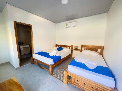Un ou plusieurs lits dans un hébergement de l'établissement Tintipan Hotel