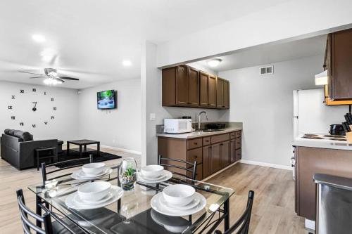 a kitchen and living room with a table and chairs at Gorgeous Two Bedroom Sleeps 6! Close to Strip! in Las Vegas