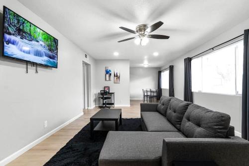 a living room with a couch and a ceiling fan at Gorgeous Two Bedroom Sleeps 6! Close to Strip! in Las Vegas