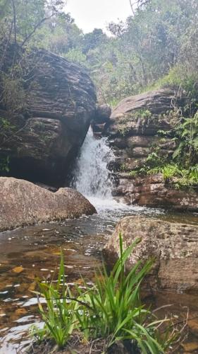 a stream of water in a river with rocks at The Mount Lodge in Nuwara Eliya
