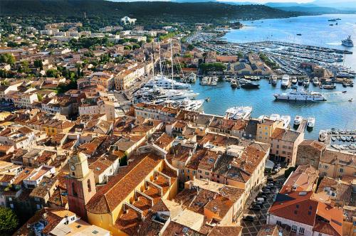 an aerial view of a harbor with boats in the water at Fortuna Residence in Saint-Tropez