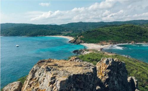 a view of the ocean and a beach at Fortuna Residence in Saint-Tropez