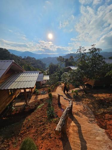 a view of a farm with the moon in the sky at อินทนนท์สุขุมทิพย์ โฮมสเตย์ in Ban Yang