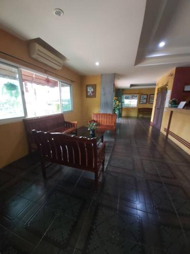 a living room with a couch and a table at Ingfah Mountainview in Hat Yai