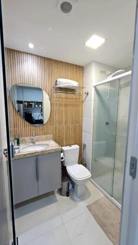 a bathroom with a toilet and a shower and a sink at Luxury Flat dos Sonhos - Edificio Compact Tambau in João Pessoa