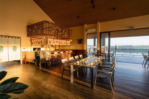 a dining room with a table and some chairs at Olala Glamping Bảo Lộc in Bao Loc