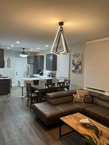 a living room with a couch and a table at Chic Retreat in Chicago