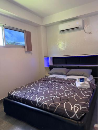 Cama o camas de una habitación en Logan Apartments