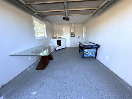 a empty room with a table and a counter in it at Exotic Home Escondido 3 Bedroom by sdstay in Escondido