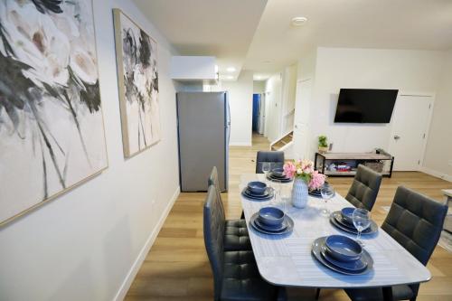 a dining room with a table and chairs at Downtown Suite King Beds,Long Stays,Disney+ in Edmonton