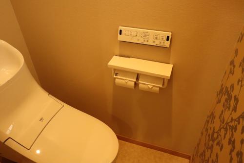 a bathroom with a white toilet and a sink at KYOSTAY Iroha Komichi in Kyoto
