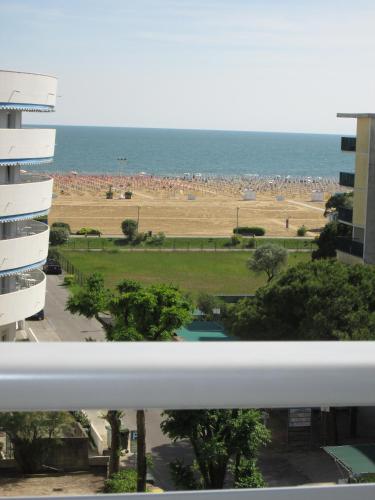 a view of the beach from a balcony of a building at Appartamenti Katja in Bibione