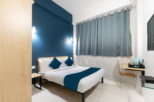 Ένα ή περισσότερα κρεβάτια σε δωμάτιο στο Hotel O C3 Celebration City Centre