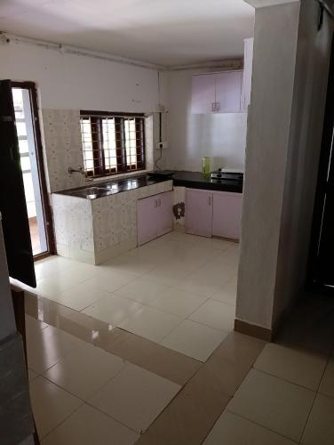 Η κουζίνα ή μικρή κουζίνα στο Kavalackal Farm House