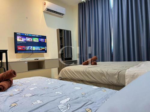 Ένα ή περισσότερα κρεβάτια σε δωμάτιο στο Kuching Riverine Diamond at 3 pax