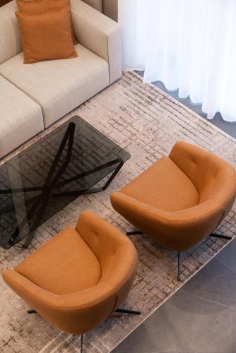 a living room with two chairs and a couch at Garni Hotel Galeria in Banja Luka