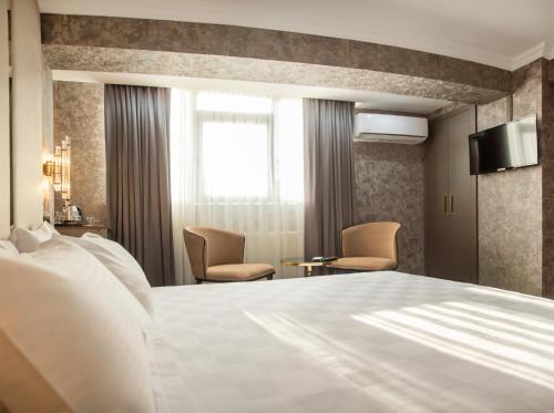 Cama o camas de una habitación en Golden Bazaar hotel