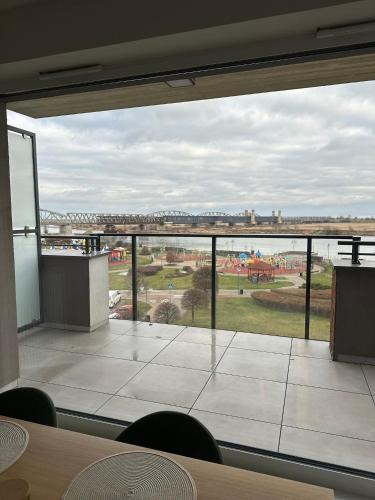 a large glass window in a room with a view at Apartament Premium Zamkowa B21 in Tczew