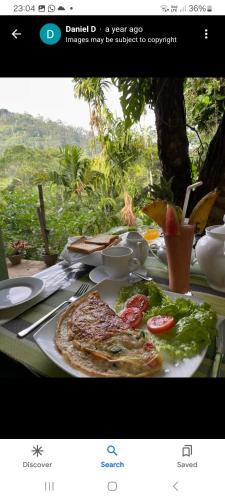 a table with a plate of food on it at Ella Secret Paradise in Ella