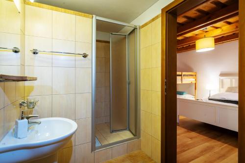 a bathroom with a sink and a shower at Apartmanica Fairy Tale, JASNÁ - SKI TÁLE- MÝTO POD ĎUMBIEROM, 3 apartments in 1 house, fireplace, free parking in Horná Lehota