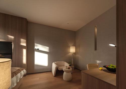 a bedroom with a bed and a chair and a table at Qingdao Wushe Yujianshanju Tangchi Seaview Hotel in Qingdao
