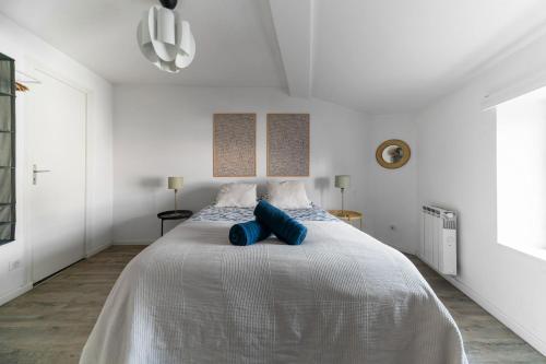 Letto o letti in una camera di La Grande Maison Clermont - Appartements centre ville