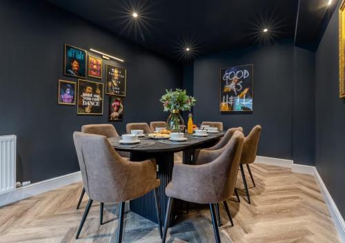 a dining room with a table and chairs at Newly Renovated luxury seaside property with hot tub - near to Cromer & Sheringham in West Runton