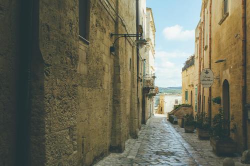 an alley in an old town with buildings at I Sassi Di Teopista in Matera