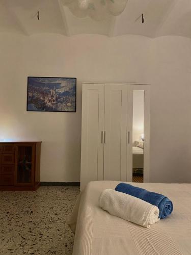 a bedroom with a bed and a painting on the wall at Casa contadina nel verde ai piedi della Majella - Agricasa Caprafico in Casoli