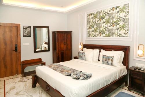 a bedroom with a bed and a large window at The Crescent in Udaipur
