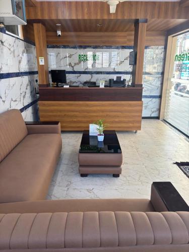 a living room with a couch and a coffee table at IVY Lemon Green in Bengaluru