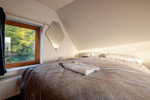 Postel nebo postele na pokoji v ubytování TheGardenloft in der Märchensiedlung