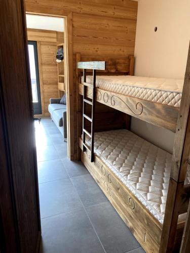 En eller flere senge i et værelse på Le Nid Douillet des Gerets