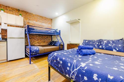 a room with a bed and a bunk bed at Studios in New York in New York
